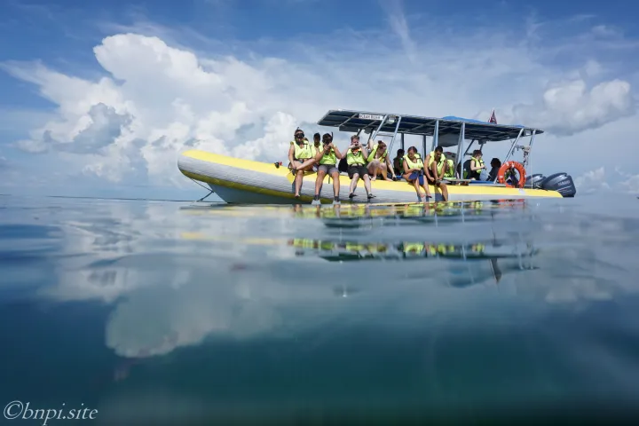 a group of people on a snorkel boat