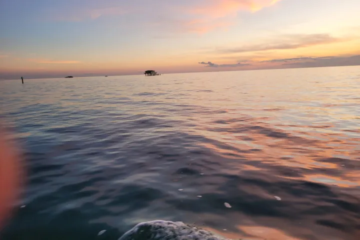 a sunset over stiltsville in Biscayne National Park