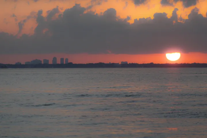 a sunset over a body of water