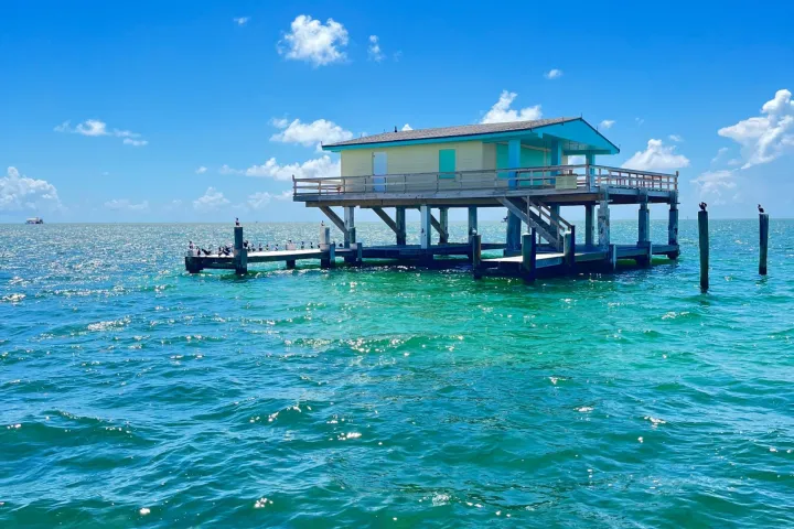 a group of people on a boat in the water