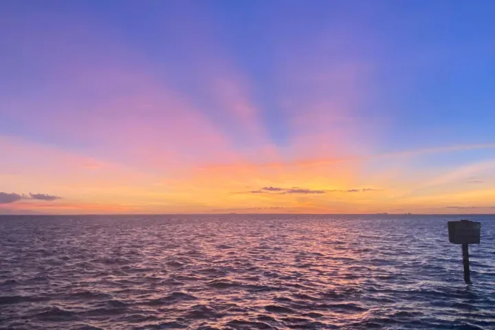 a sunset over a body of water