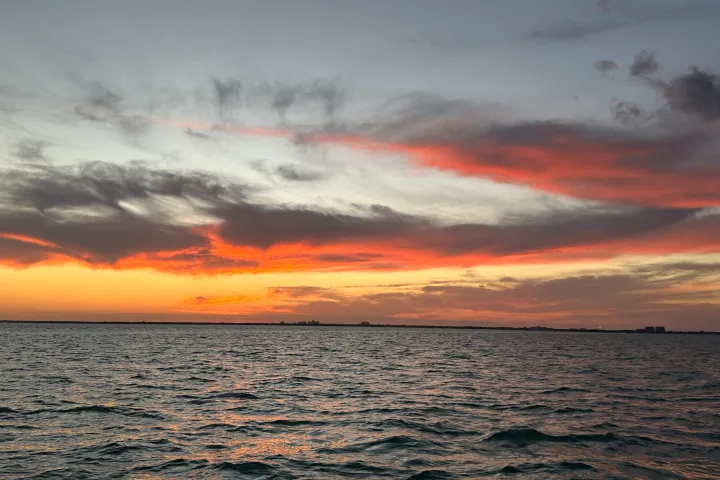 a sunset over a body of water