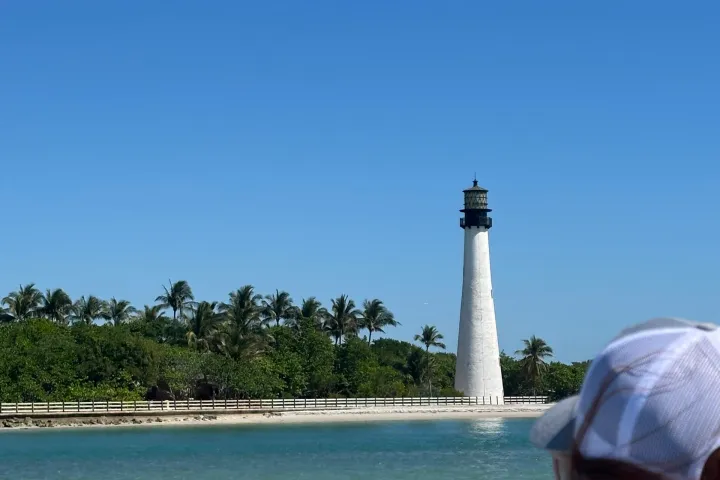 a person driving a boat in the water