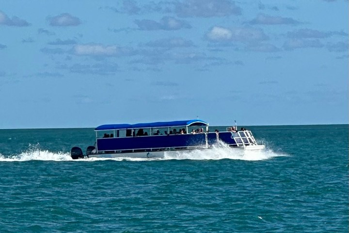a boat traveling across a large body of water